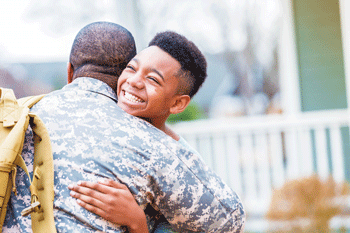 01 boy hugs mil dad